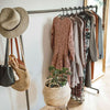 free standing clothes rack made from dark water pipes for open wardrobe in bedroom